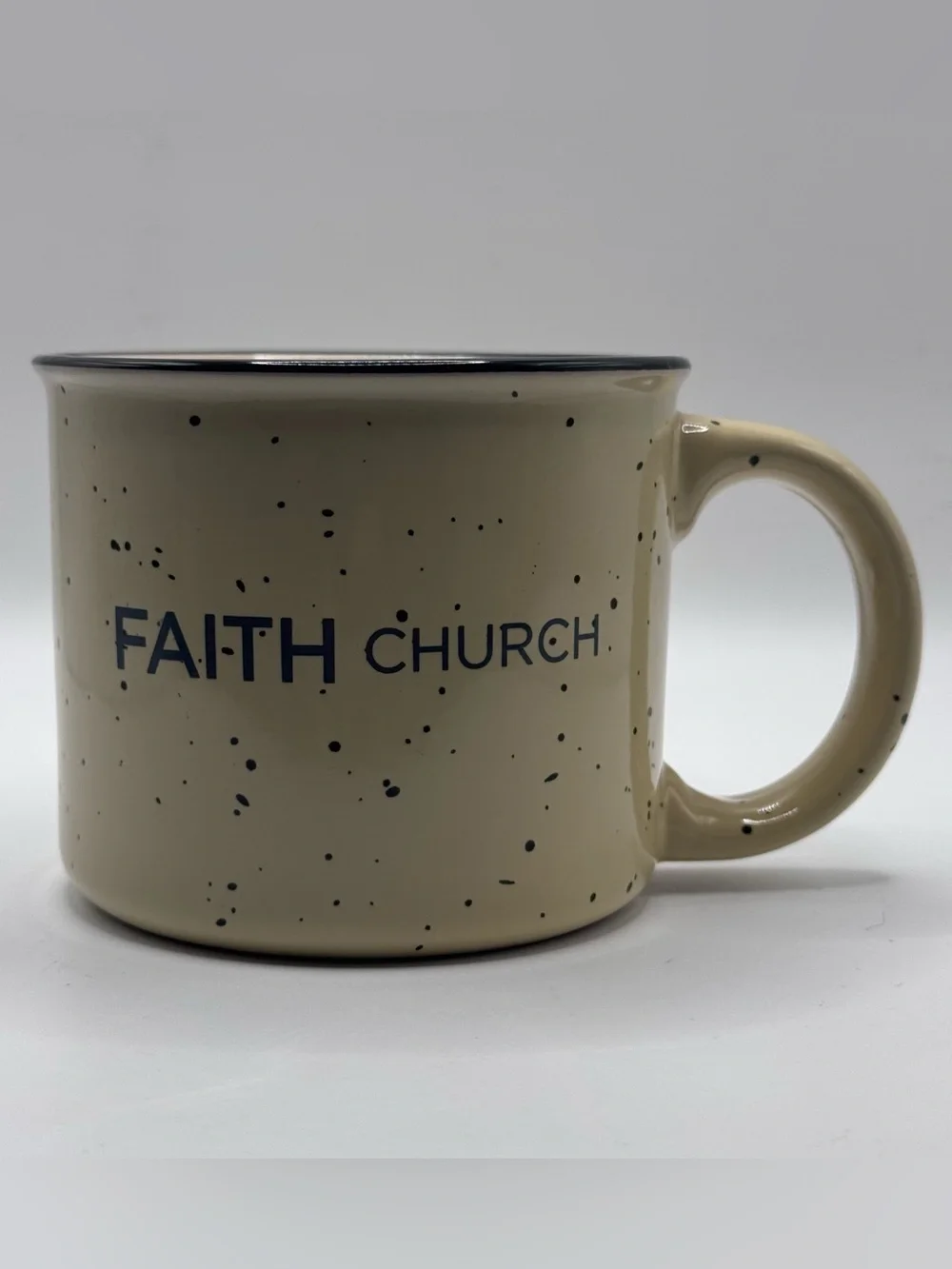 FAITH CHURCH Yellow Campfire Coffee Mug with Black Specks And Black Rim